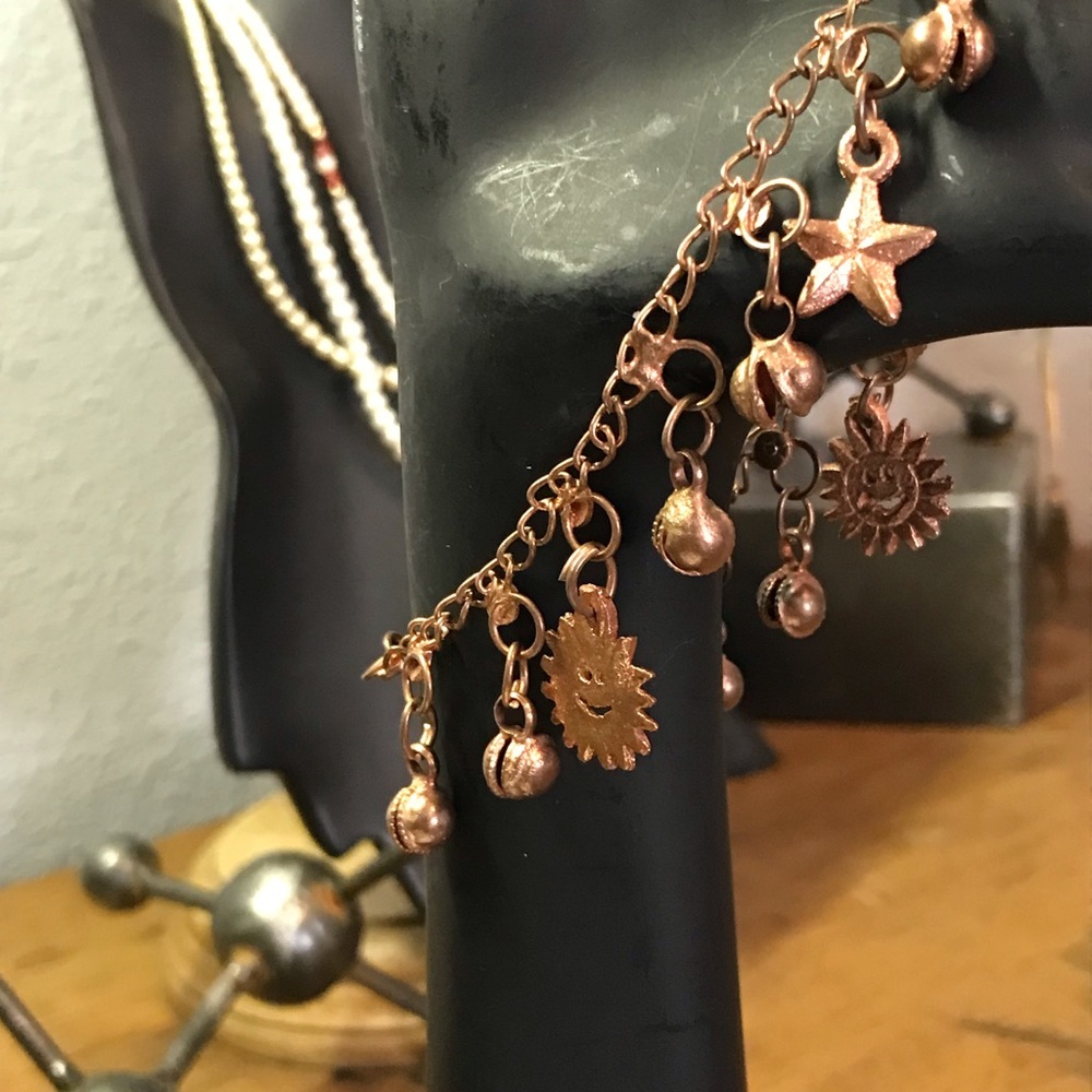 Copper charm bracelet suns clams moon star
